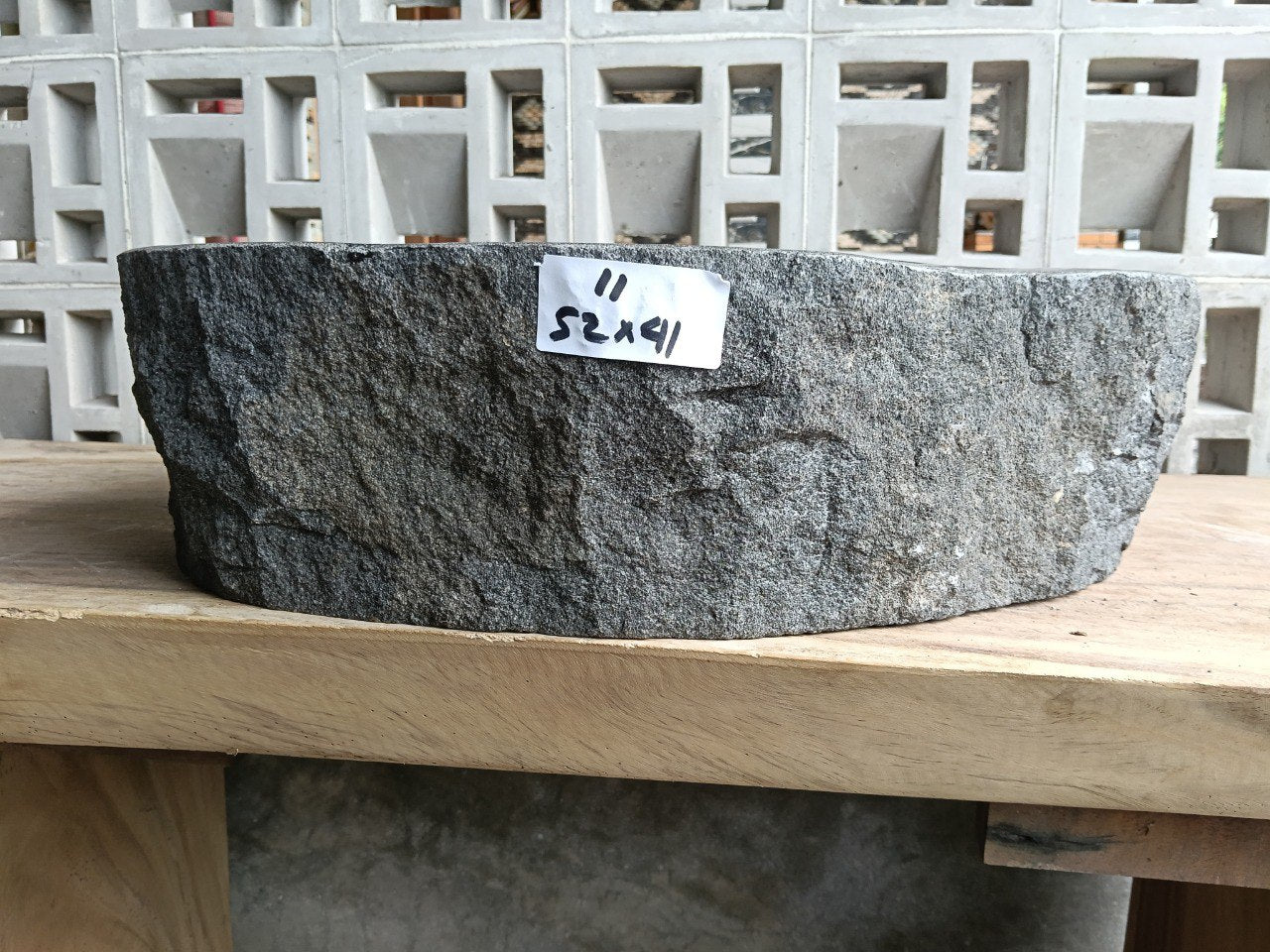 Front view of handcrafted asymmetrical oval andesite bathroom sink
