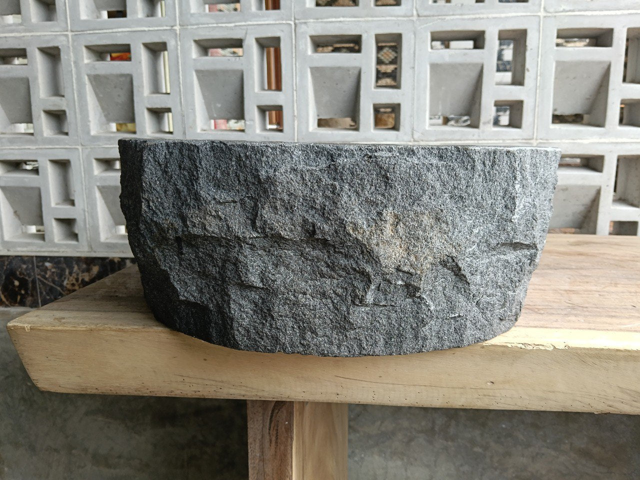 Back view showing natural split-rock exterior of andesite stone sink
