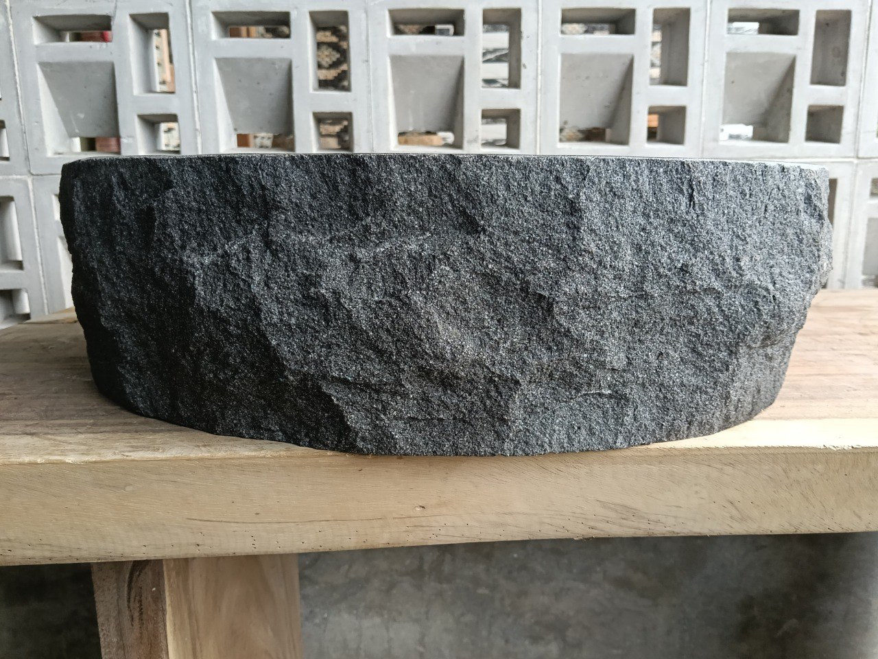 Right side view of handcrafted dark gray andesite sink
