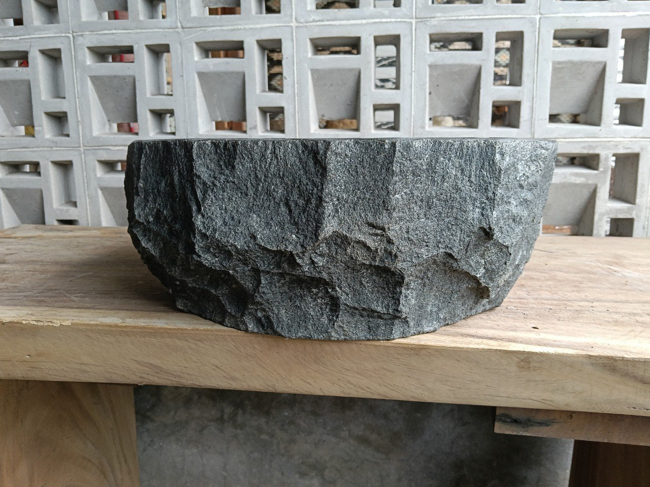 Back view showing split-rock exterior of andesite stone sink
