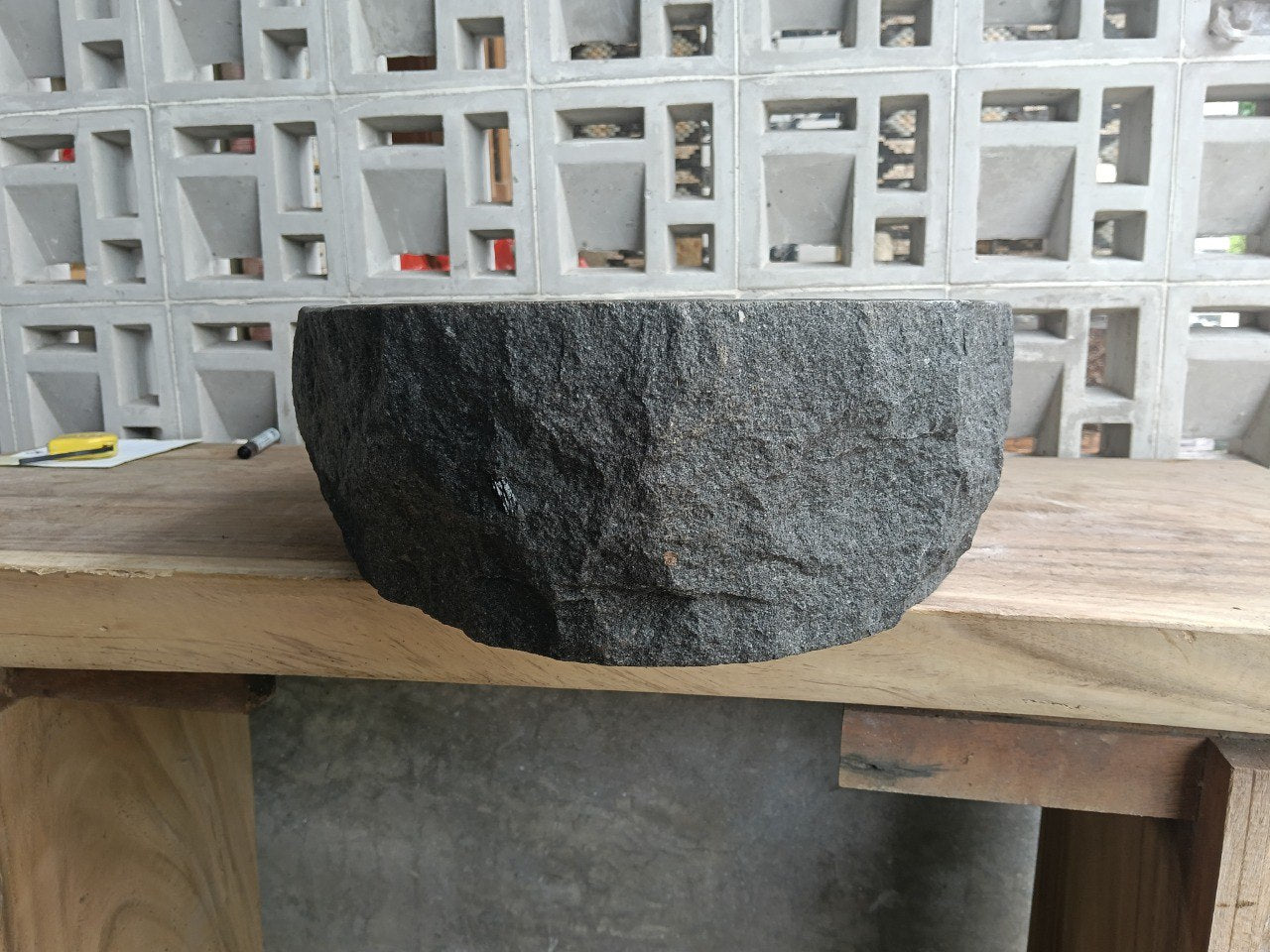 Back view showing split-rock exterior of andesite stone sink

