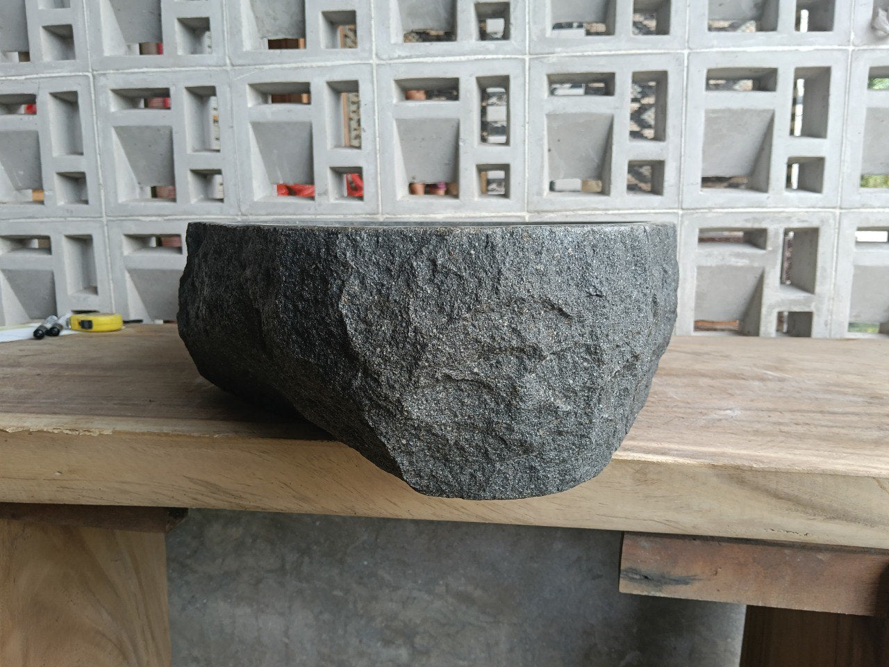 Back view showing split-rock exterior of andesite stone sink
