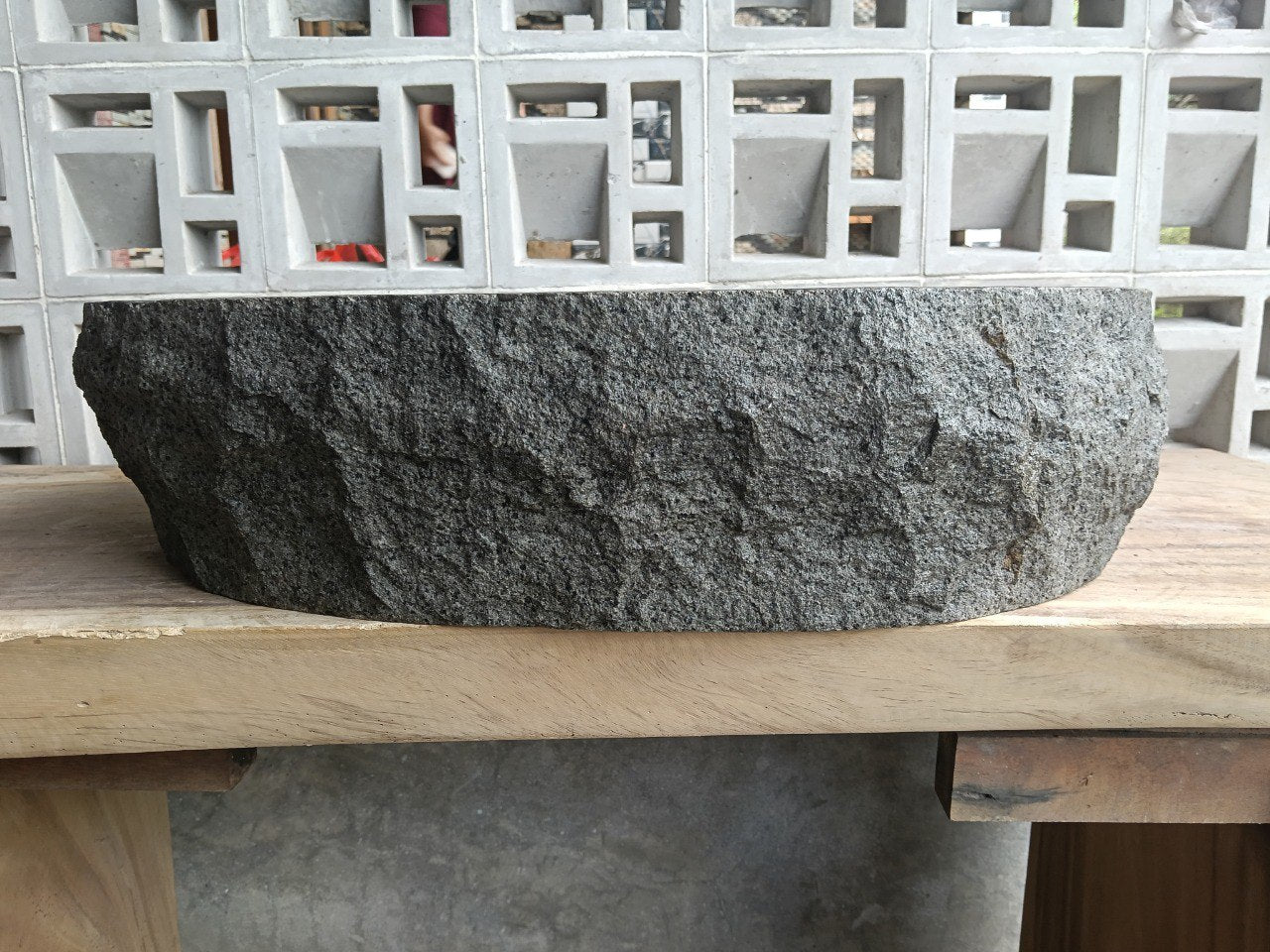 Front view of handcrafted elongated oval andesite bathroom sink
