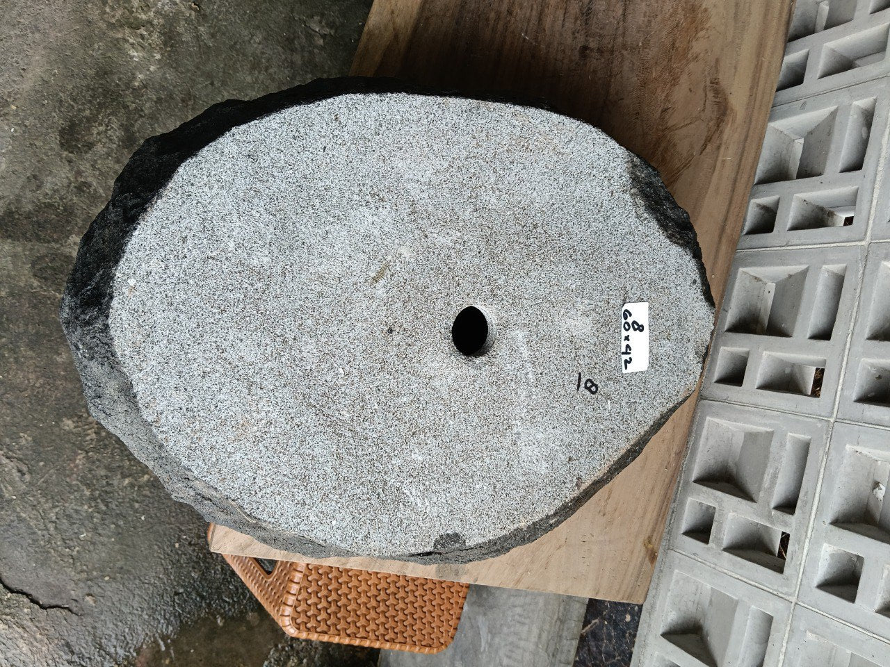 Right side perspective of handcrafted dark gray stone sink
