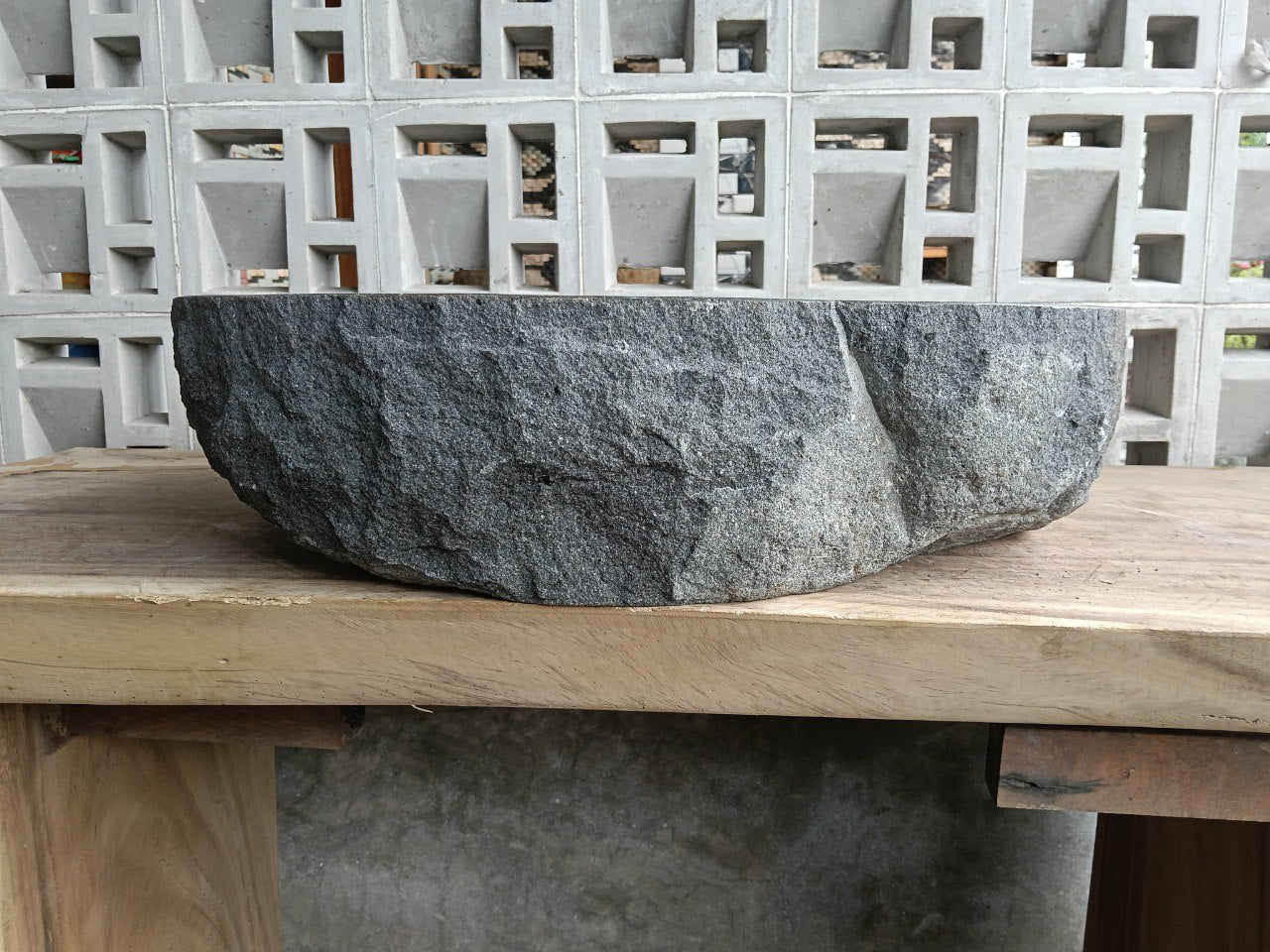 Back view showing split-rock exterior of andesite stone sink
