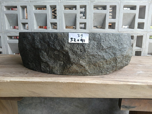 Front view of handcrafted oval andesite bathroom sink with natural veining
