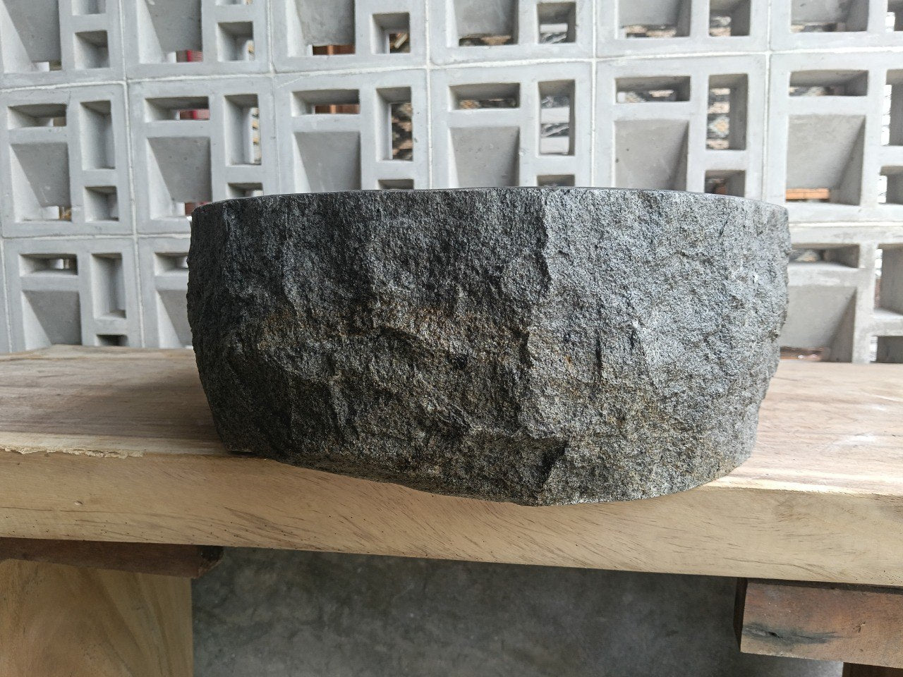 Left side perspective of polished oval andesite basin
