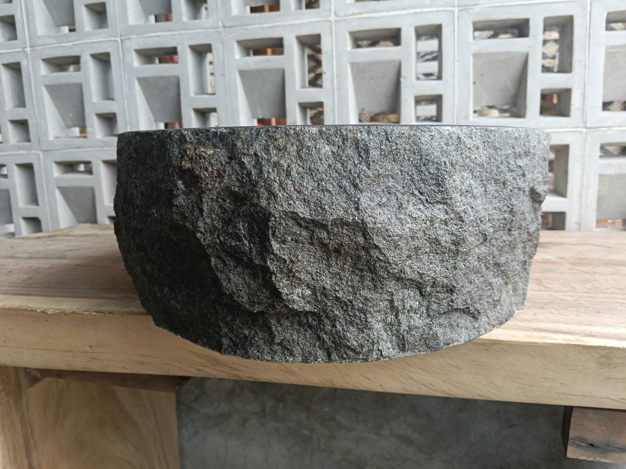 Right side perspective of handcrafted oval dark gray andesite sink
