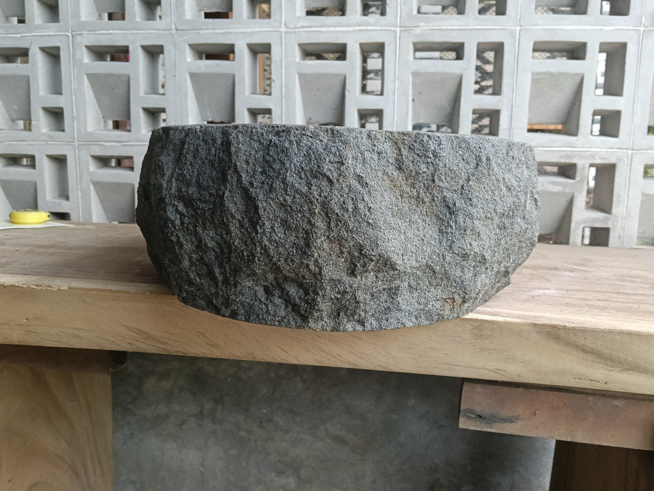 Left side perspective of polished oval andesite basin
