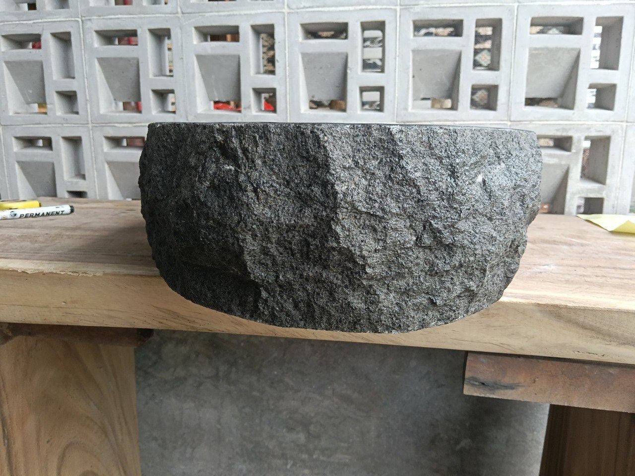 Back view showing split-rock exterior of elongated andesite sink

