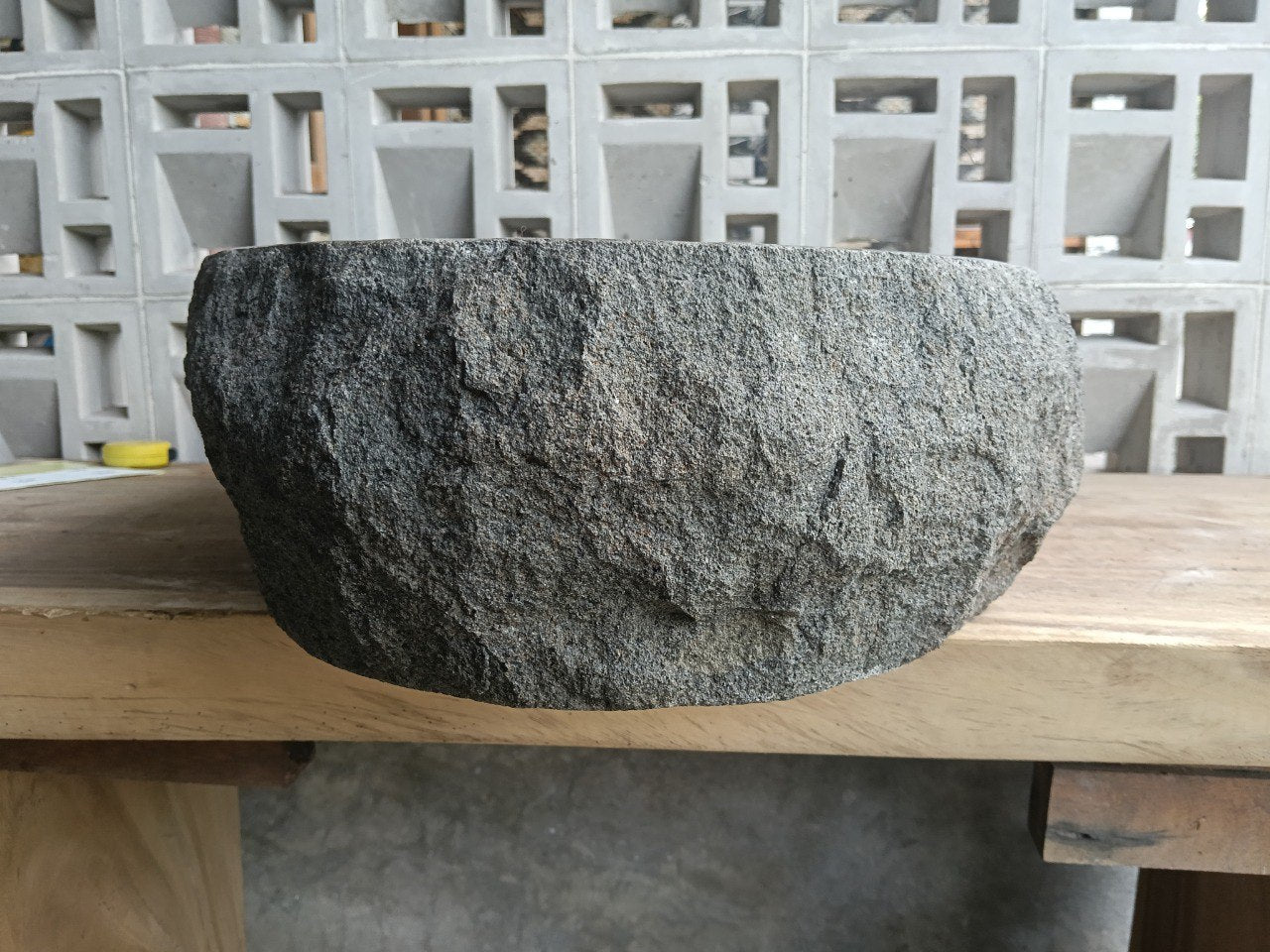 Back view showing split-rock exterior of elongated andesite sink
