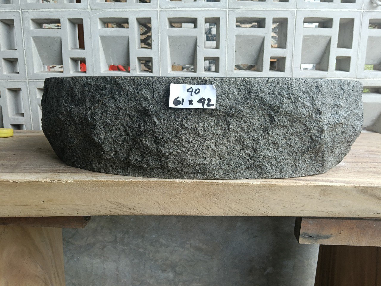 Front view of handcrafted elongated oval andesite bathroom sink
