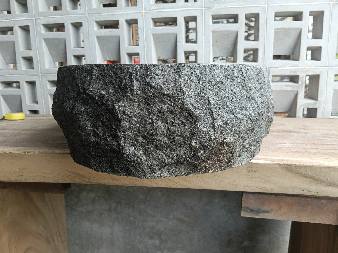 Right side perspective of handcrafted dark gray andesite stone sink
