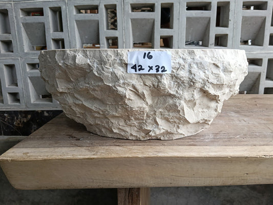Front angle of handcrafted beige marble oval basin
