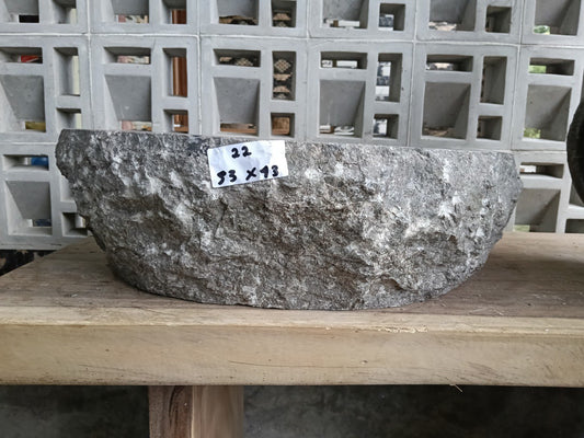 Front angle of handcrafted oval gray marble basin
