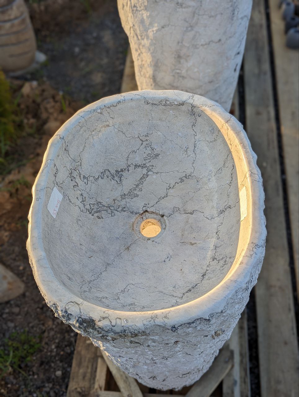 Top interior view of polished white marble pedestal sink
