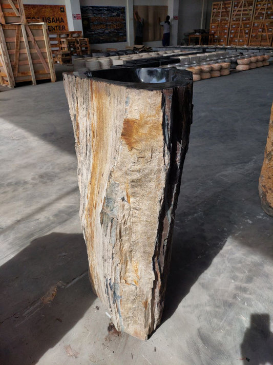 Front view of petrified wood pedestal sink with natural texture
