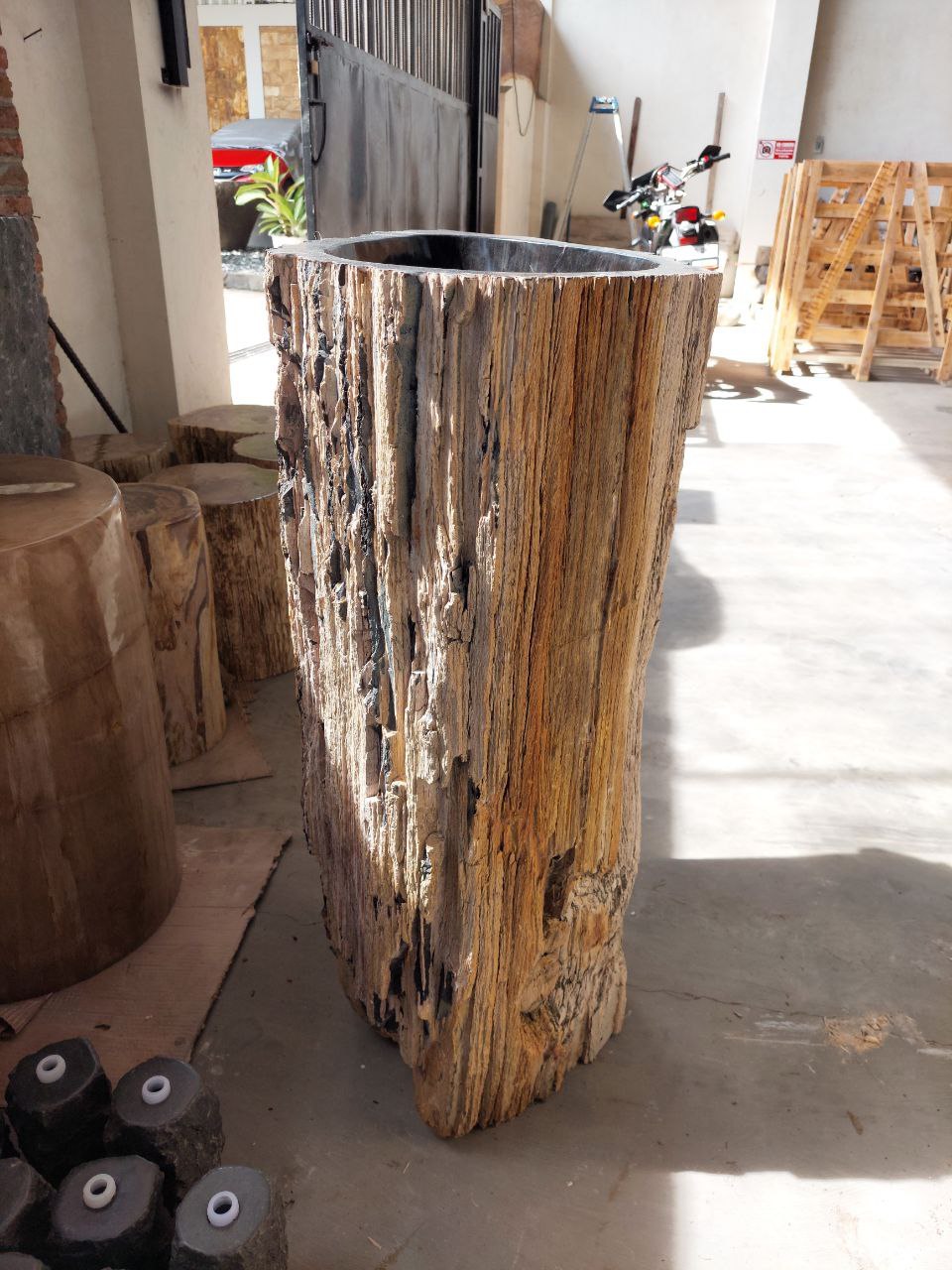 Top polished interior of petrified wood pedestal sink
