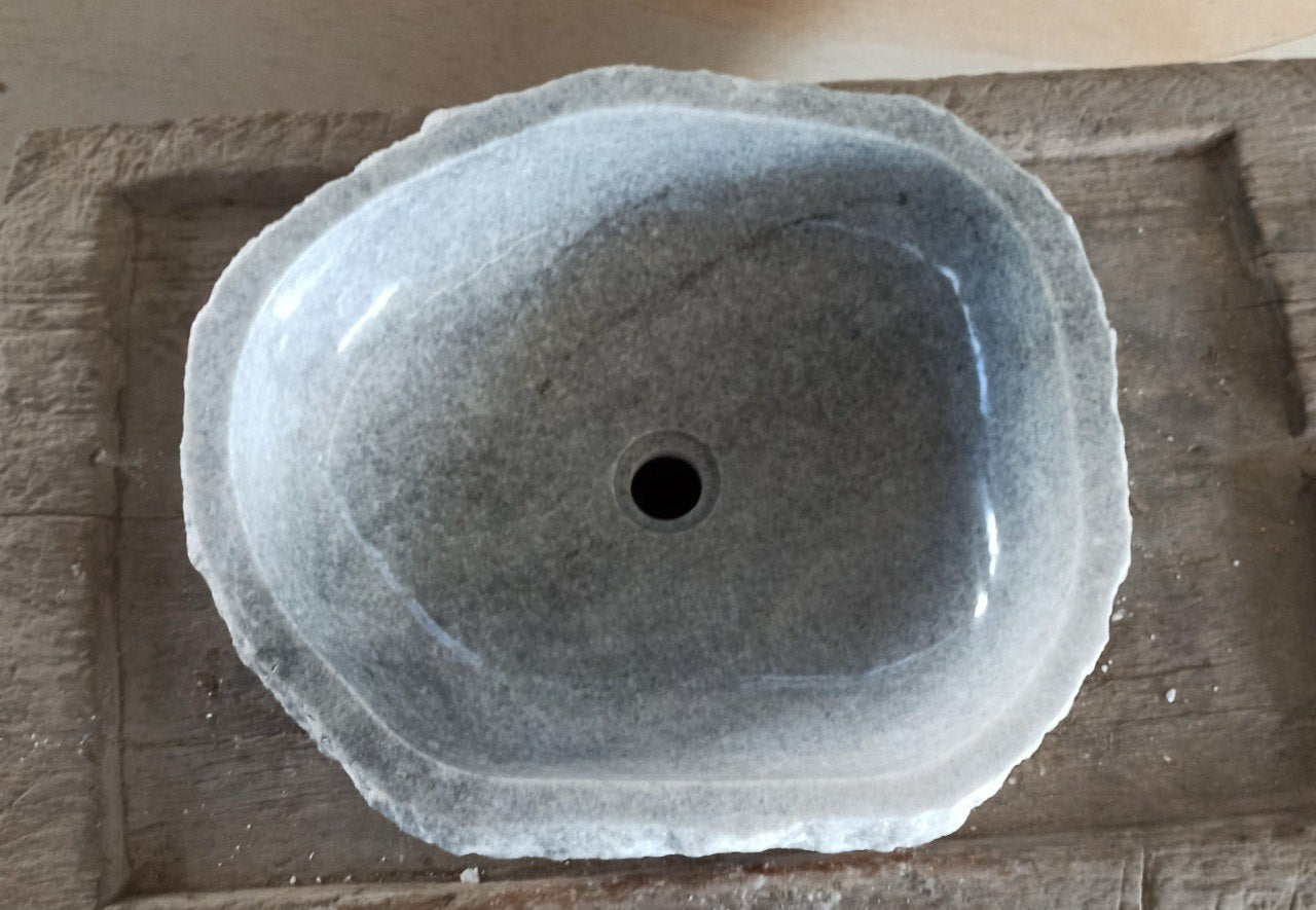 Top view of 5091-524515 light gray onyx sink with polished interior and rough natural exterior, triangular organic shape.
