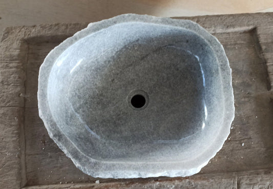 Top view of 5091-524515 light gray onyx sink with polished interior and rough natural exterior, triangular organic shape.
