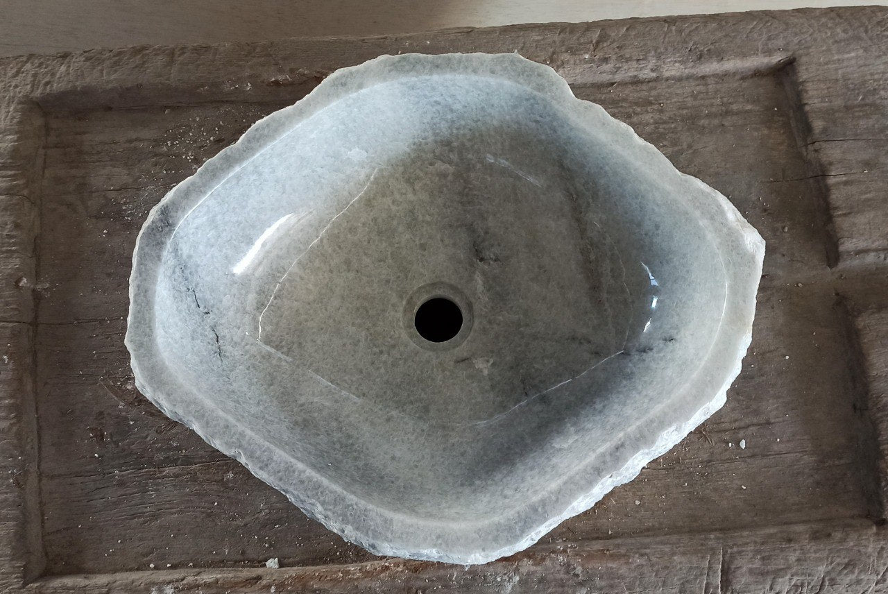 Top view of 5088-534216 light gray onyx sink with polished interior and rough natural exterior, triangular organic shape.
