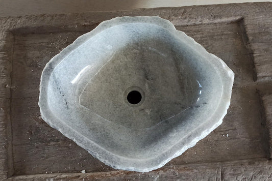 Top view of 5088-534216 light gray onyx sink with polished interior and rough natural exterior, triangular organic shape.
