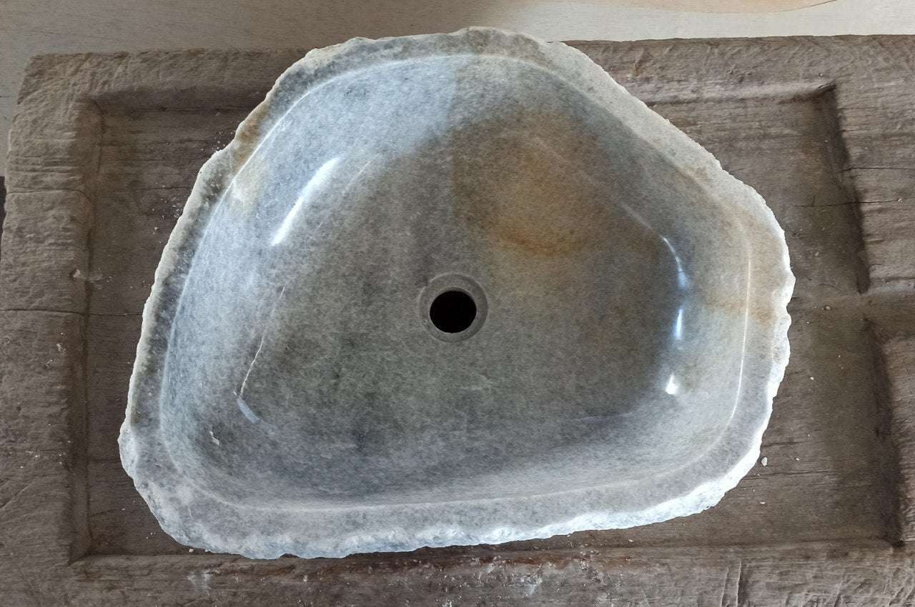 Top view of 5089-553515 gray–beige onyx sink with polished interior and rough natural exterior, triangular organic shape.

