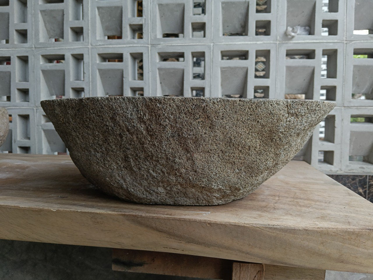 Back view of 6890-4744 handcrafted stone bathroom basin with raw exterior texture
