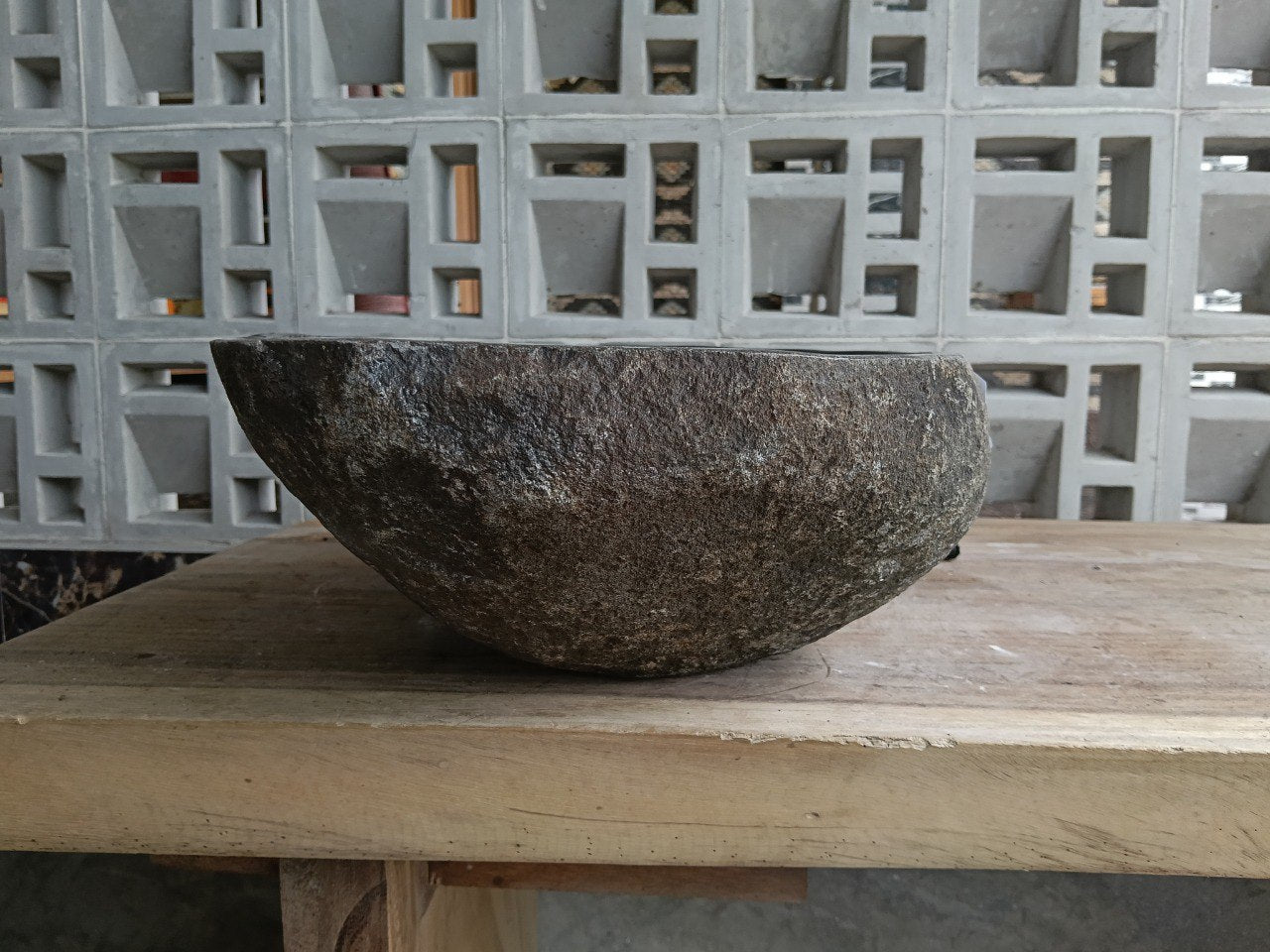 Left side of 6924-4732 river stone vessel sink, dark gray polished bowl
