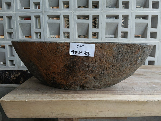 Front view of 6925-4733 natural river rock vessel sink with brown-oxide exterior
