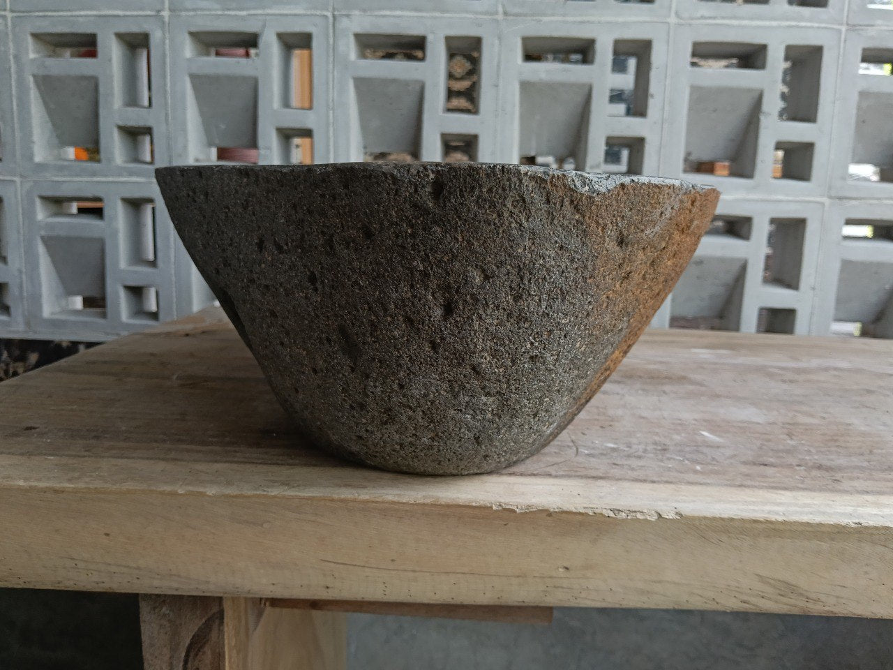 Left side of 6925-4733 river stone sink, dark polished interior and rustic brown-gray exterior
