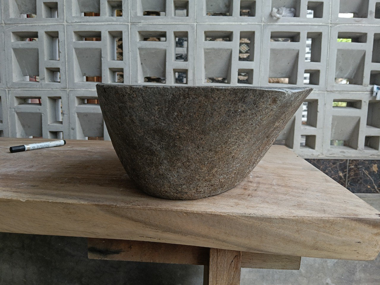 Left side of 6927-4533 river stone sink, gray polished bowl and natural brown exterior
