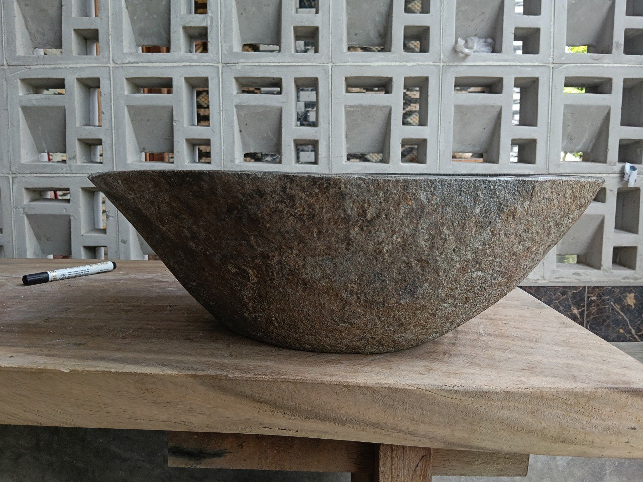 Back view of 6927-4533 handcrafted stone bathroom basin with raw exterior texture
