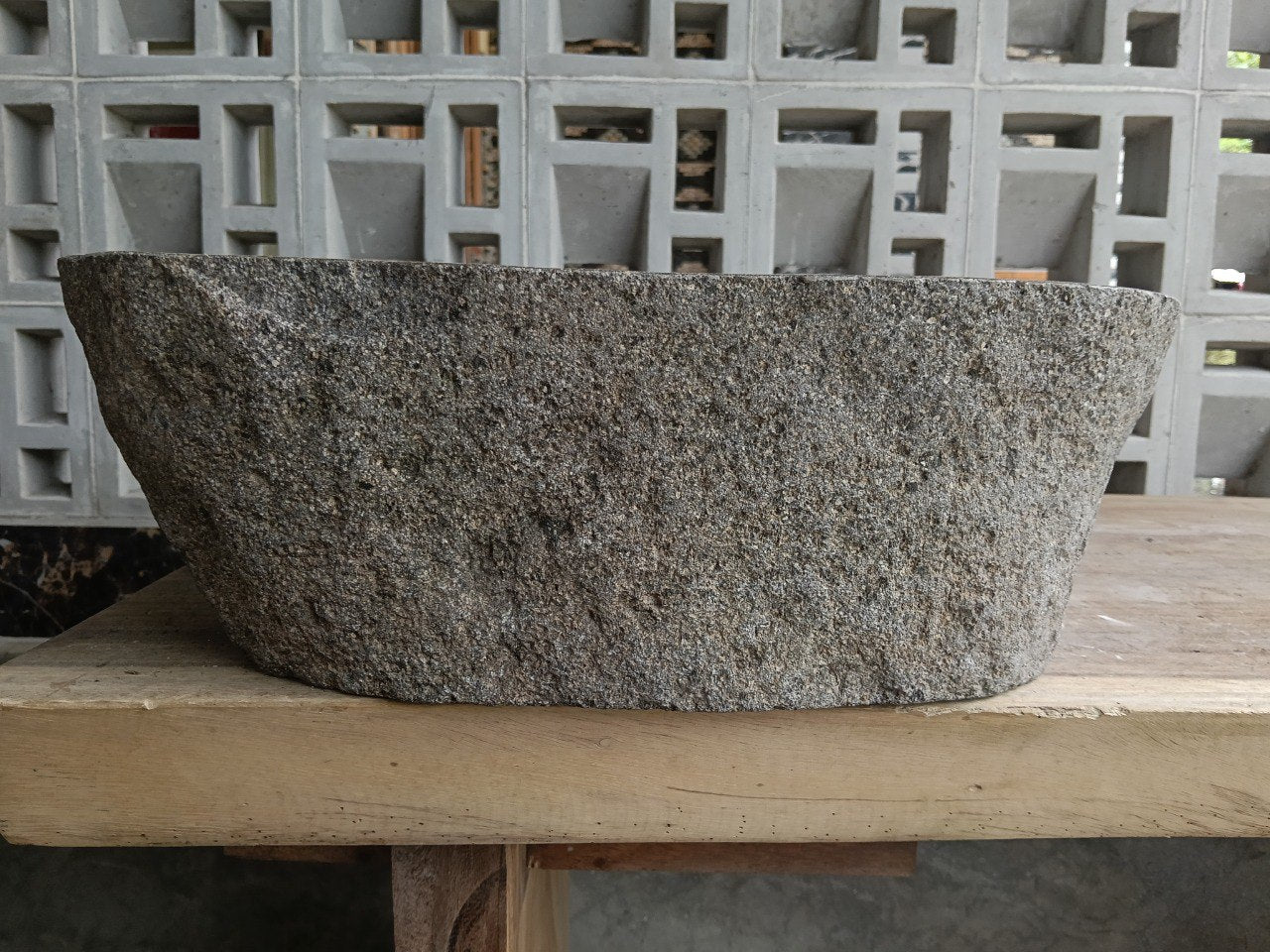 Back view of 6931-4735 handcrafted stone bathroom basin with raw textured exterior
