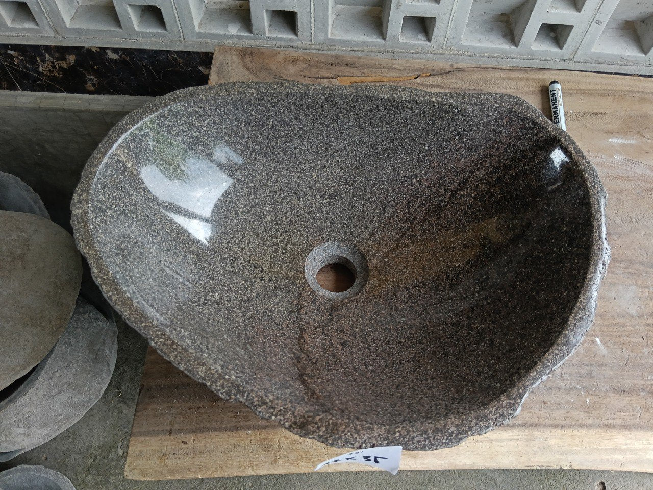 Top view of 6931-4735 two-tone river stone sink with polished gray-brown interior
