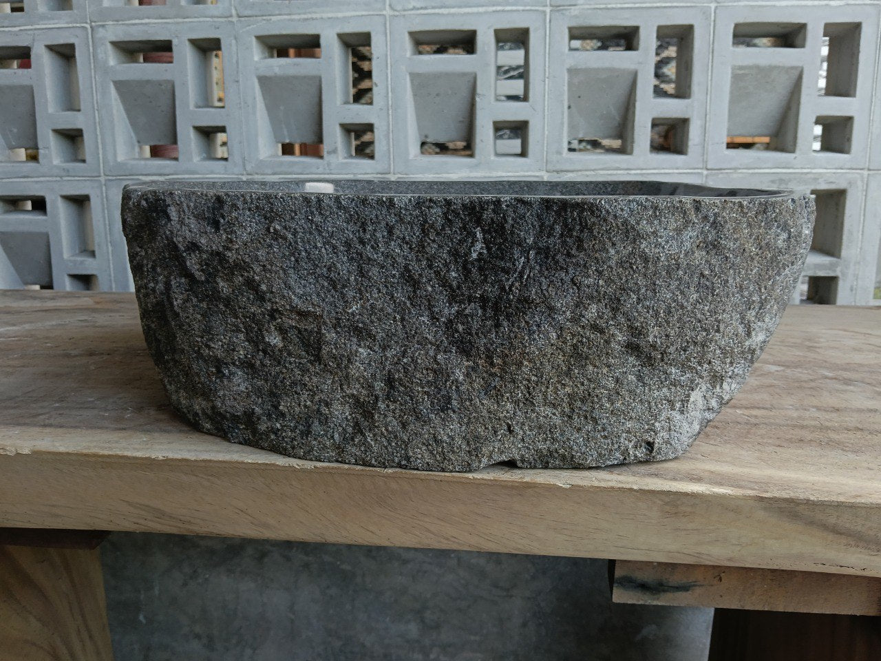 Back view of 6951-4540 handcrafted river rock bathroom basin with raw exterior
