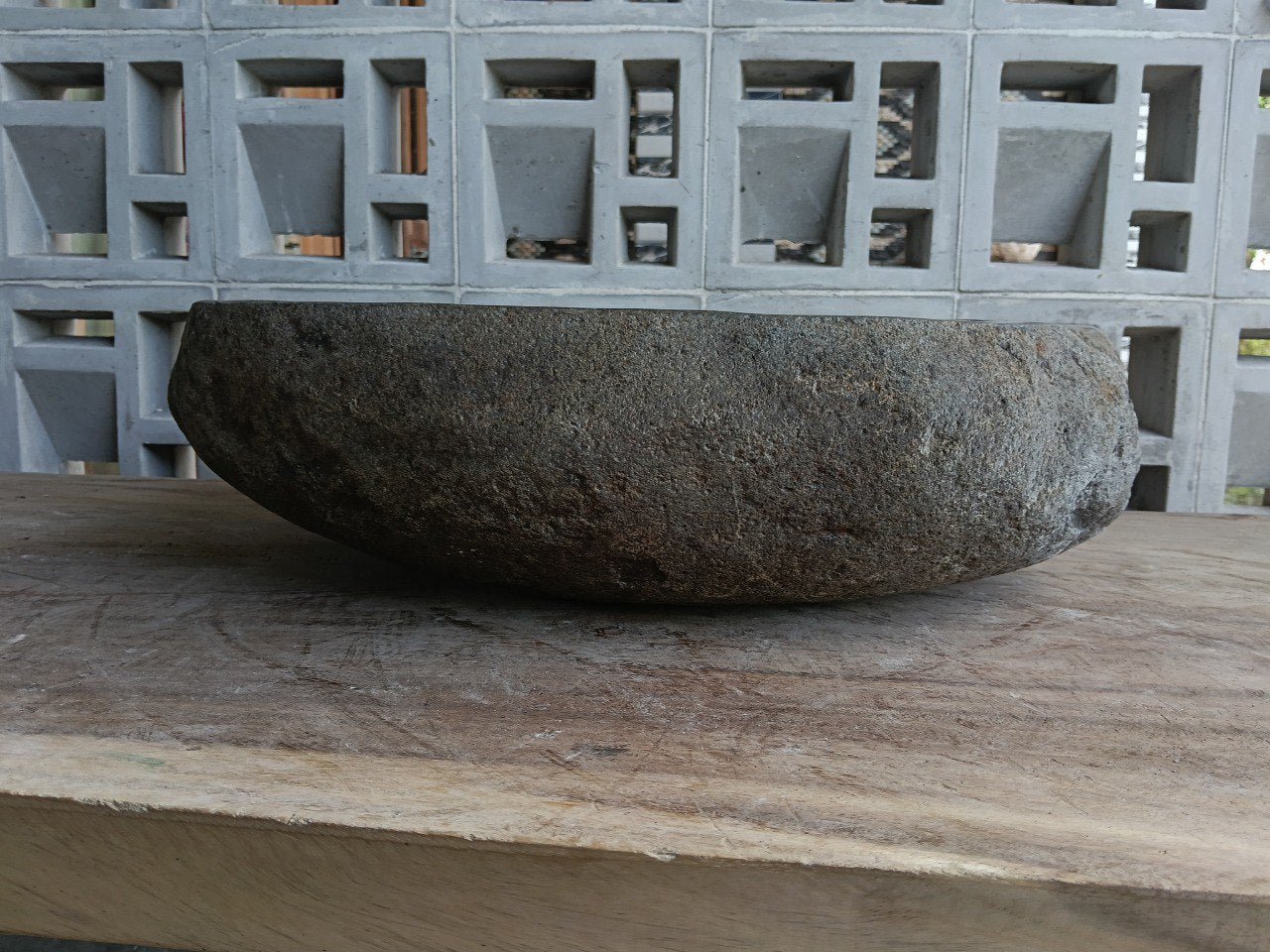 Back view of 6952-4843 handcrafted stone bathroom basin with raw textured exterior
