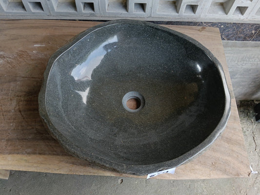 Top view of 6952-4843 dark gray river stone sink with polished oval interior
