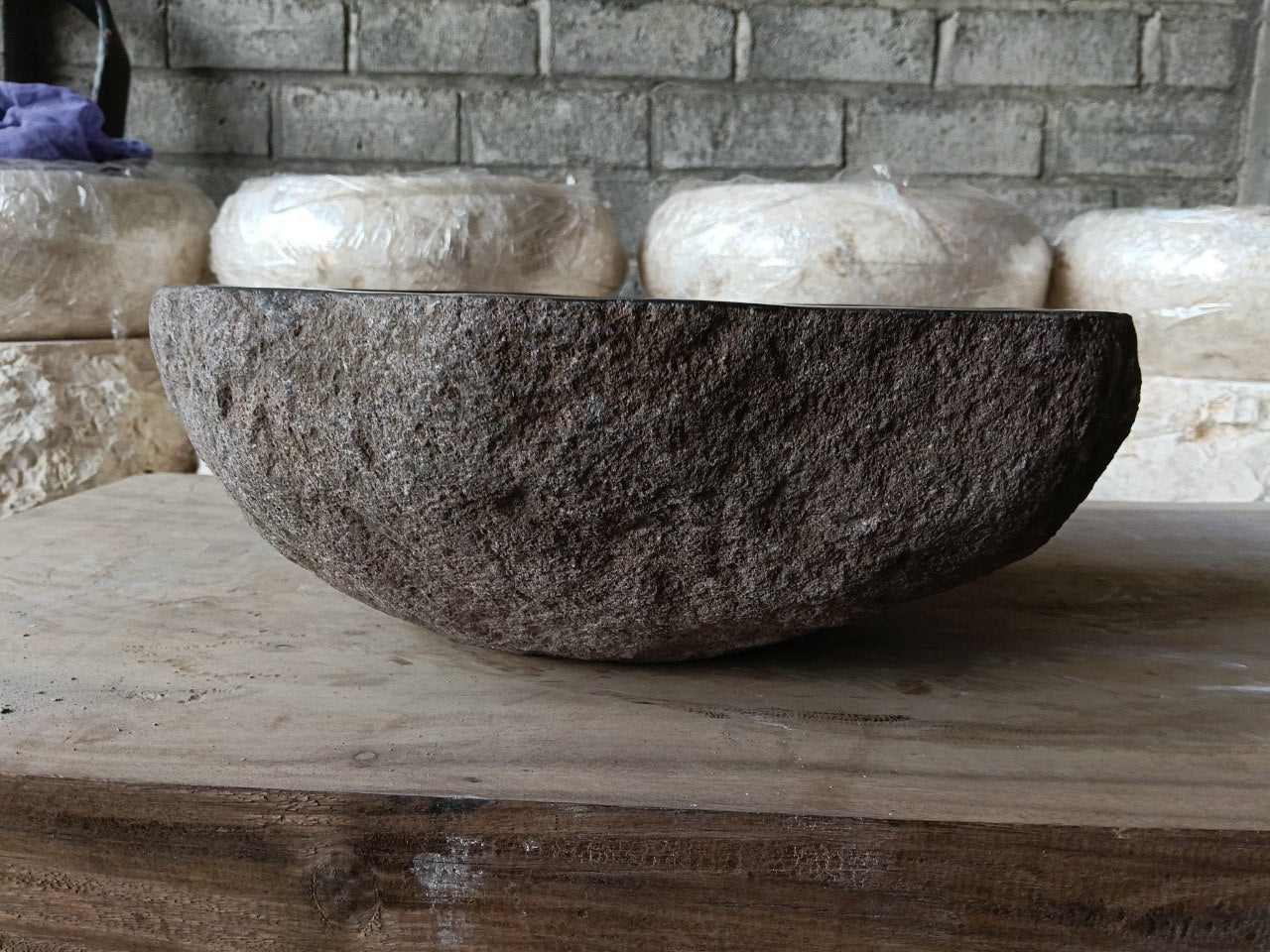 Back view of 6959-4136 handcrafted stone bathroom basin with raw textured exterior
