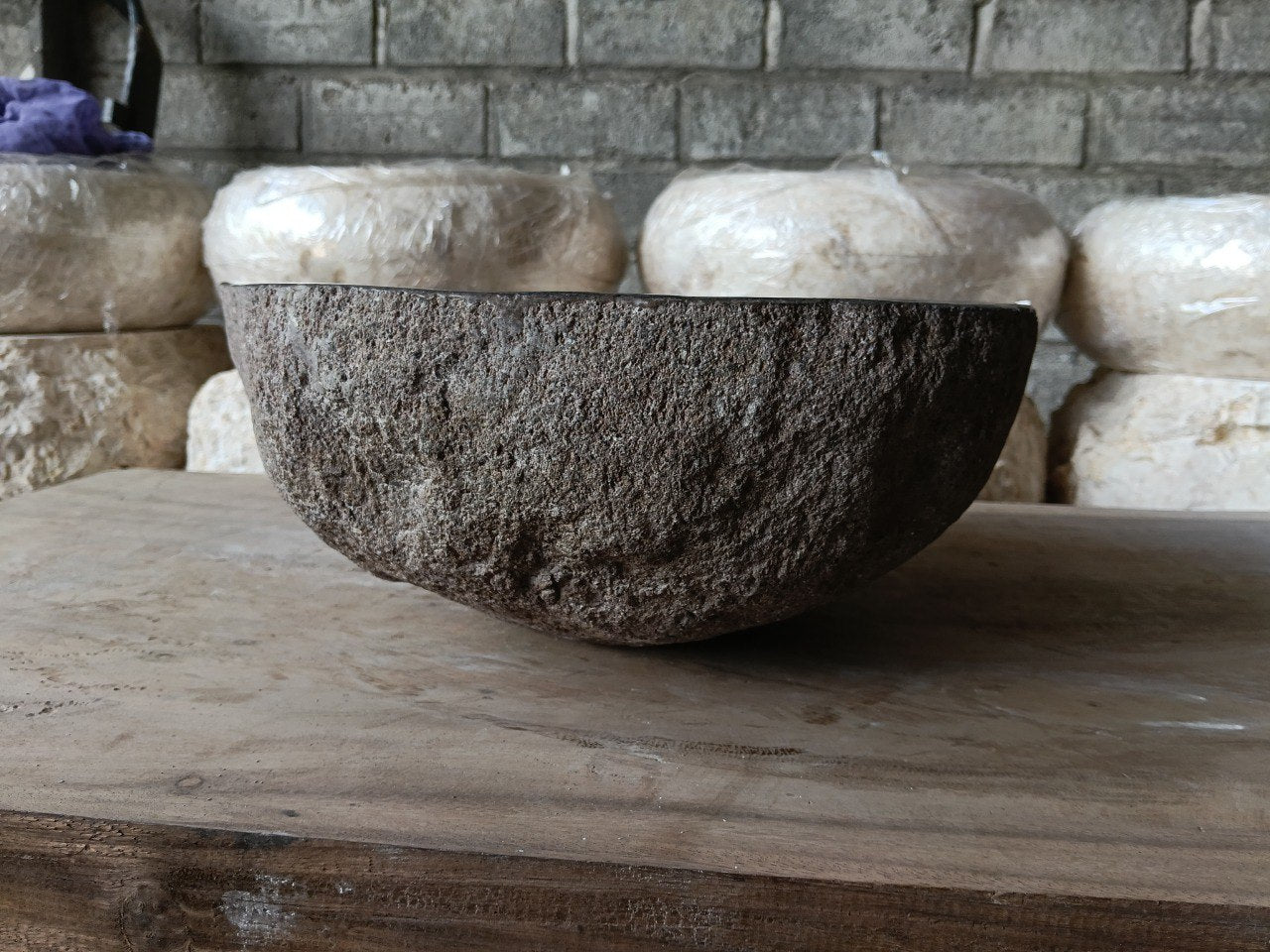 Left side of 6959-4136 river stone sink, gray-brown natural rock surface
