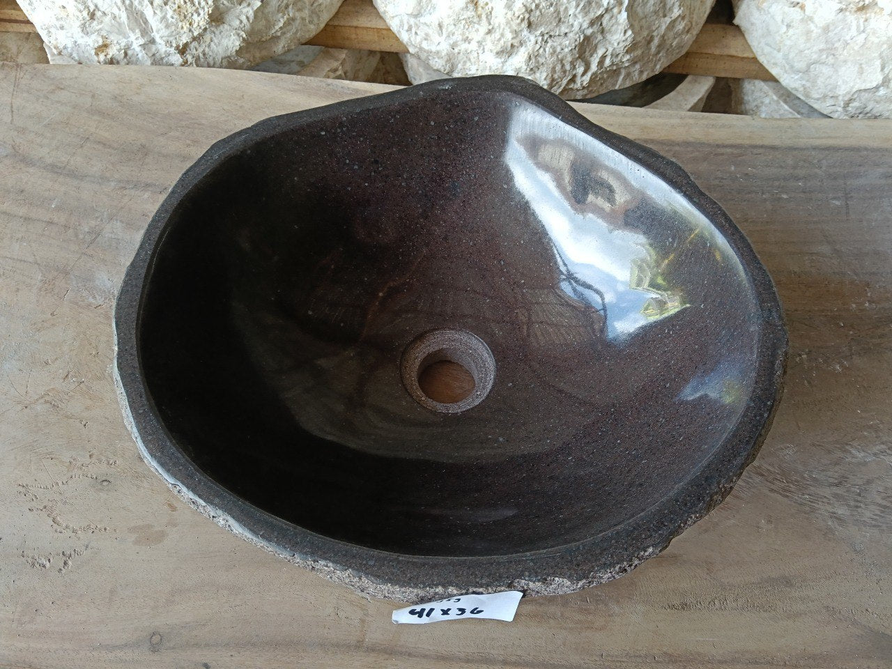 Top view of 6959-4136 dark brown river stone sink with polished interior
