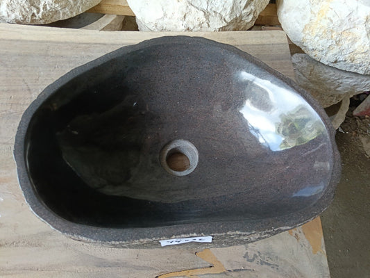 Top view of 6961-4432 faceted river stone sink with polished dark interior
