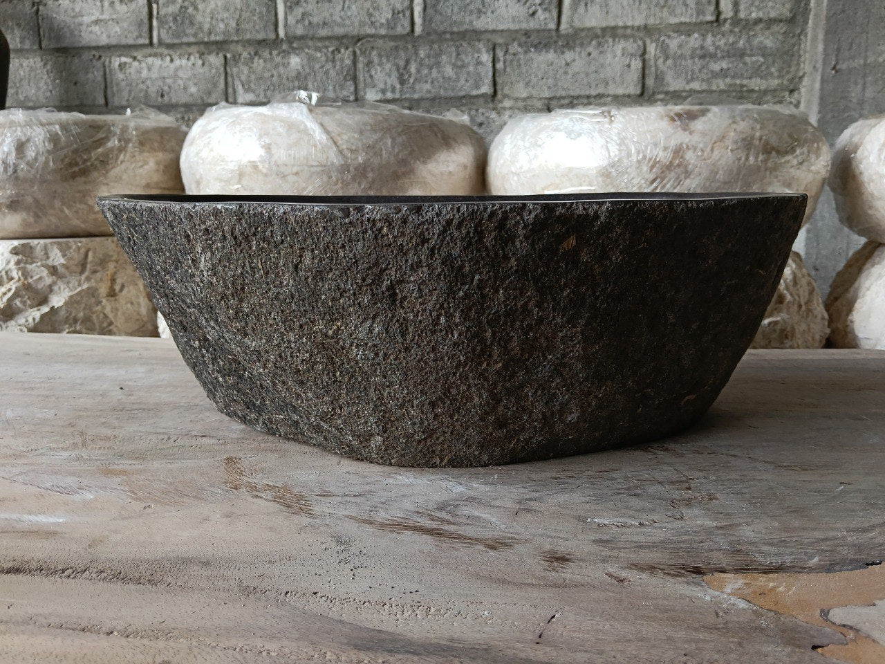 Back view of 6961-4432 natural stone bathroom basin with raw textured exterior
