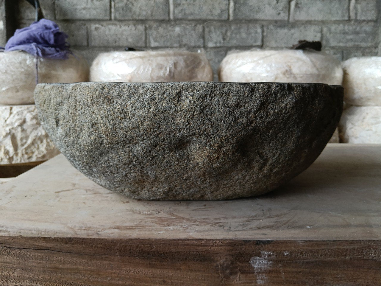Back view of 6967-4436 handcrafted stone bathroom basin with raw textured exterior
