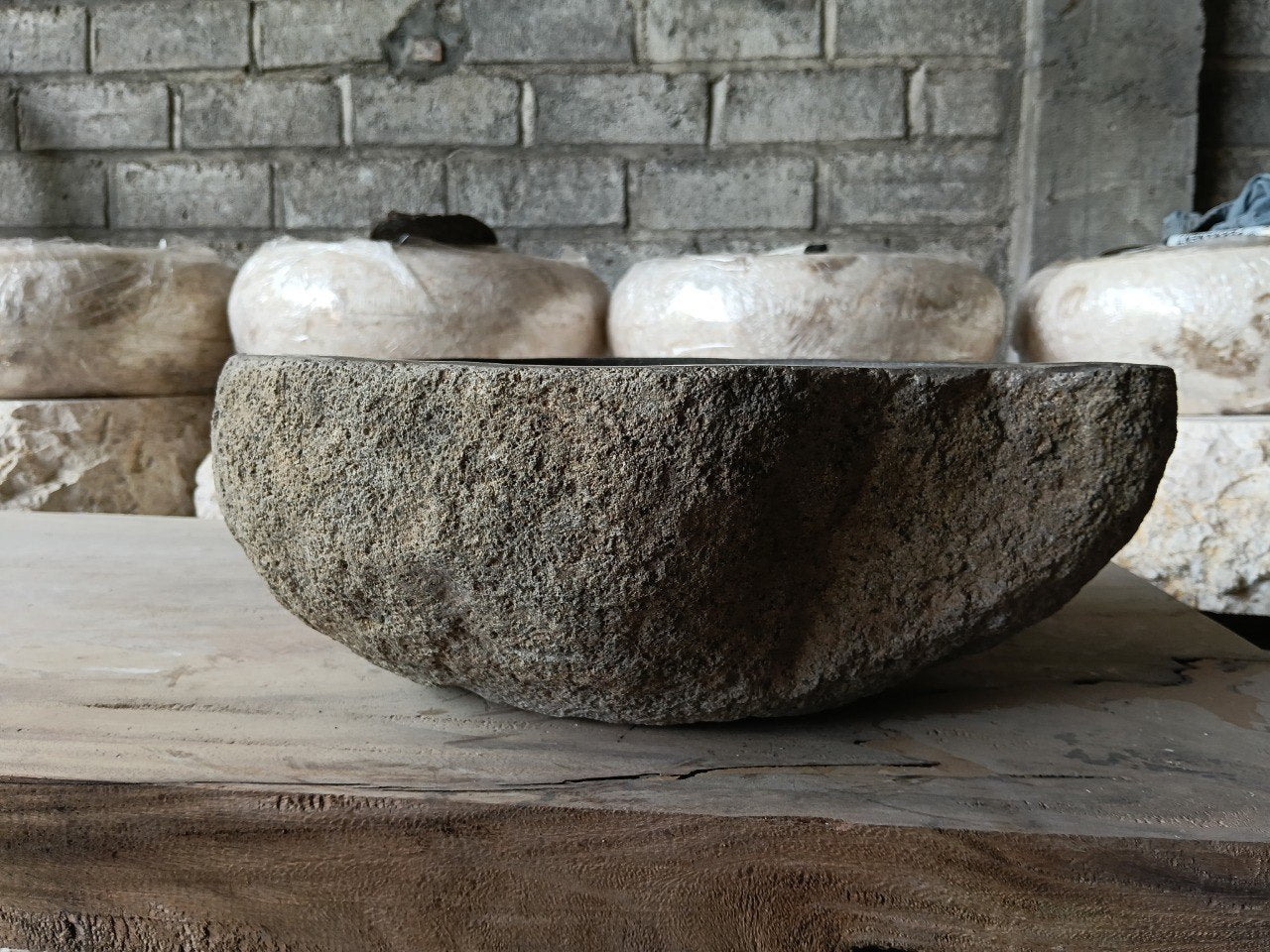 Back view of 6968-4136 handcrafted stone bathroom basin with raw textured exterior
