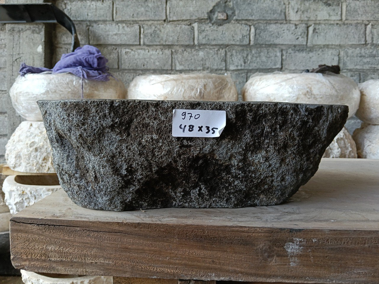 Front view of 6970-4835 natural river rock vessel sink, raw textured exterior
