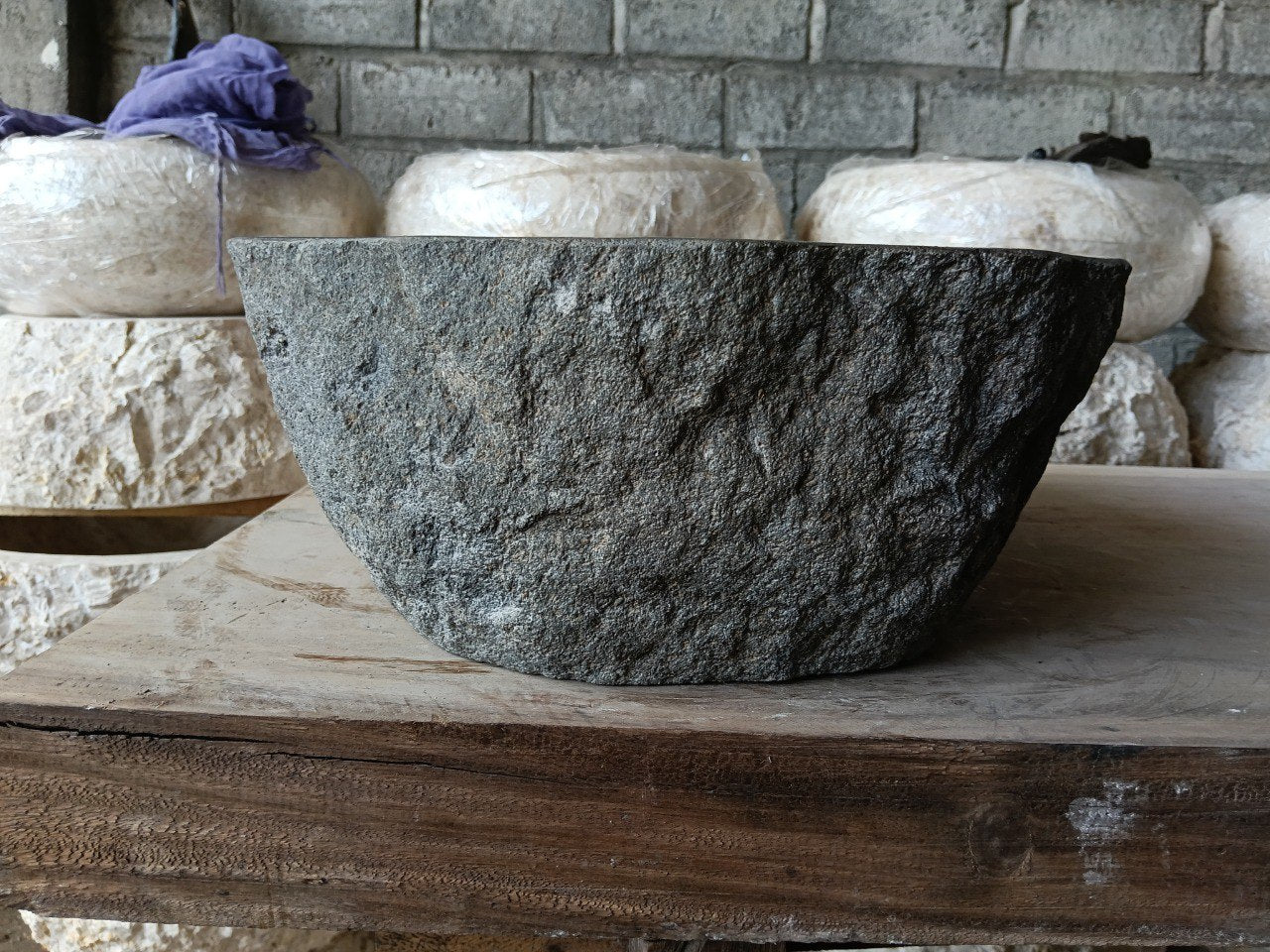 Left side of 6970-4835 river stone vessel sink in graphite gray
