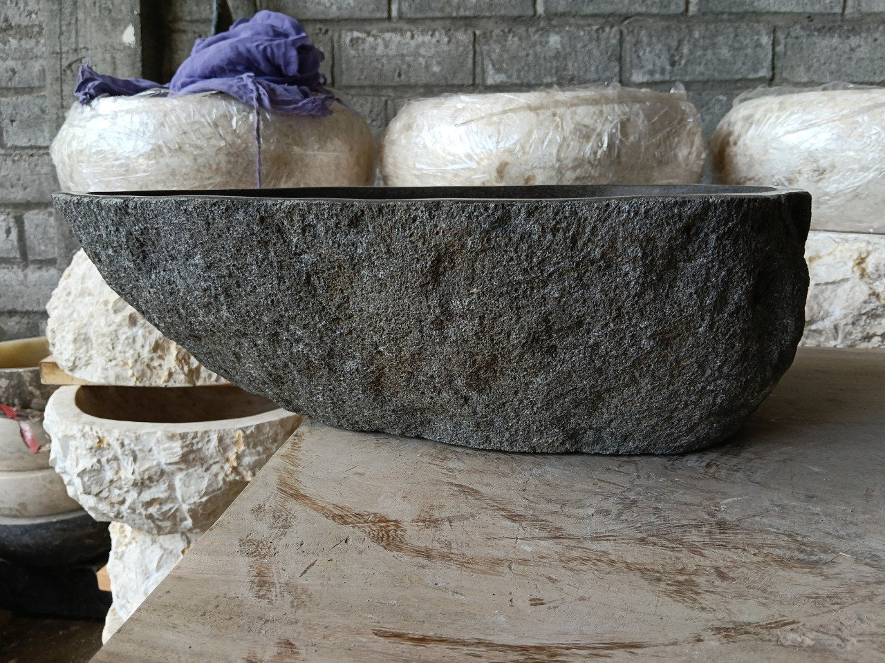 Back view of 6970-4835 handcrafted stone bathroom basin with organic shape
