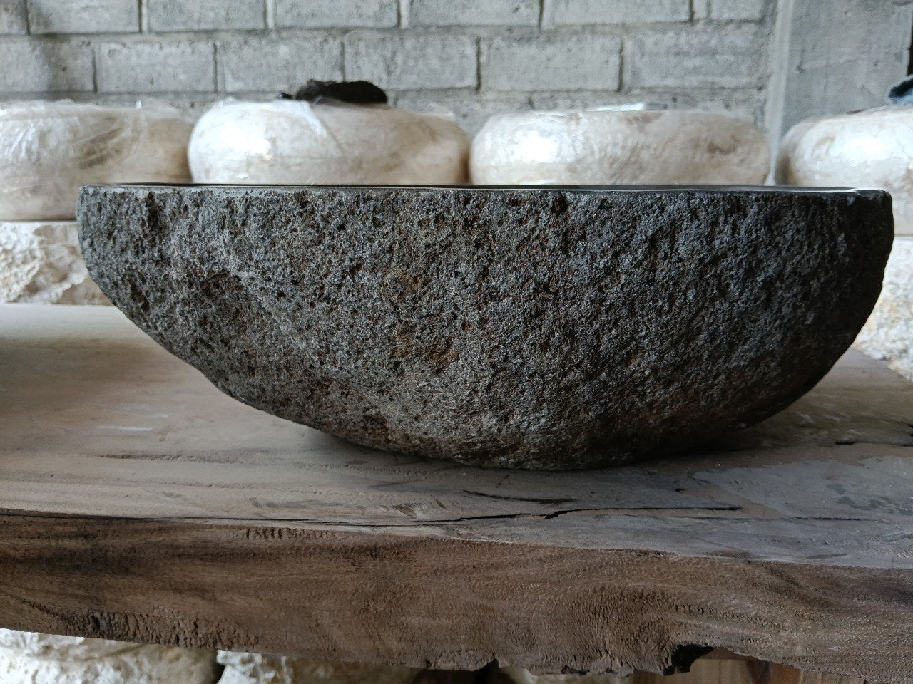 Back view of 6971-4835 handcrafted stone bathroom basin with organic oval shape
