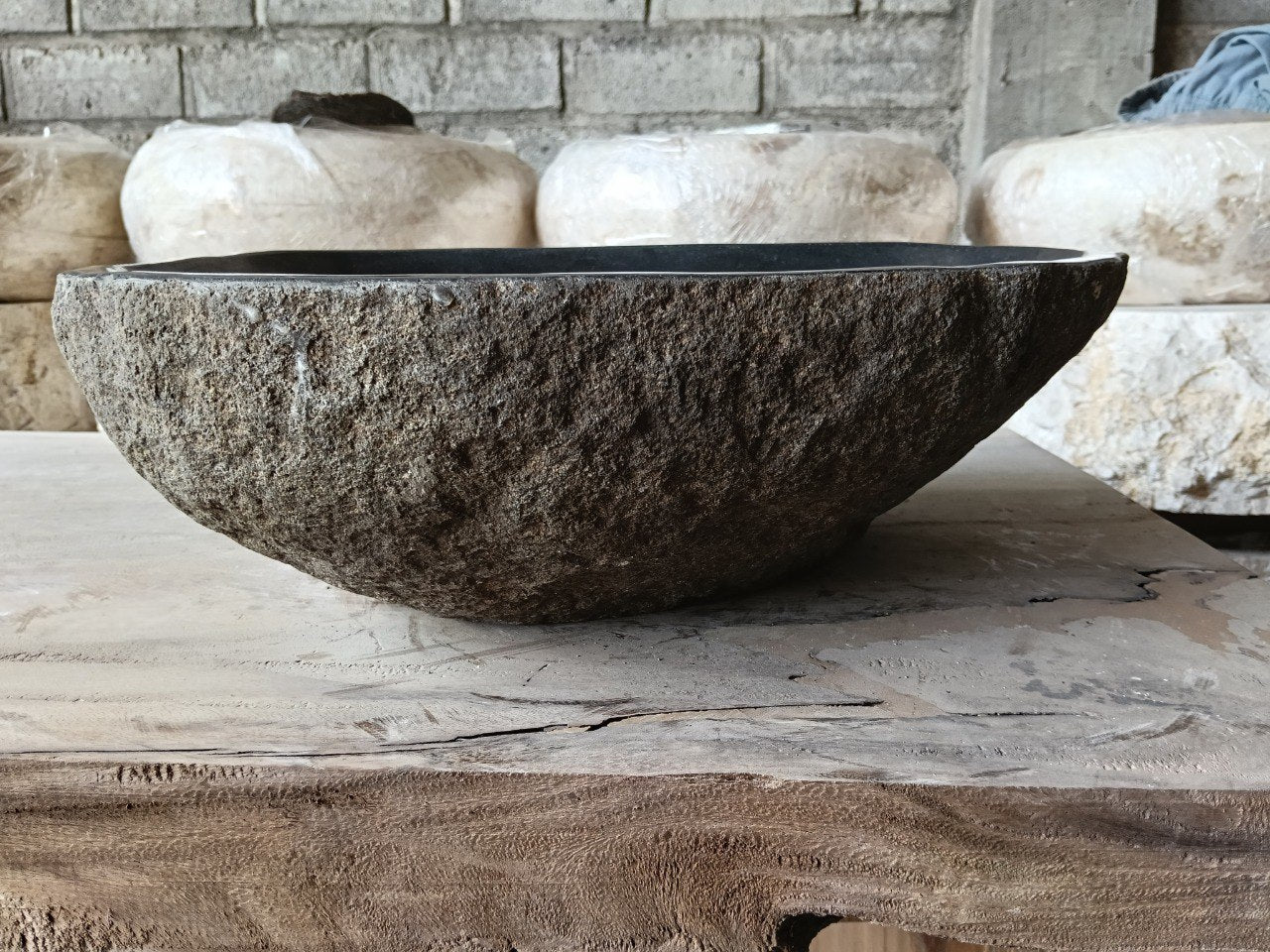 Back view of 6973-4635 handcrafted stone bathroom basin with organic oval shape
